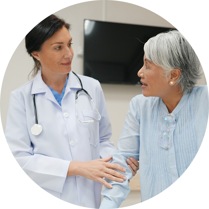 Doctor with elderly woman patient